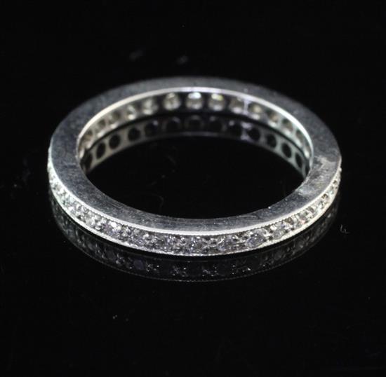 A modern platinum and diamond full eternity ring, size J.